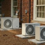 multiple air conditioning fans/units outside of a brick building